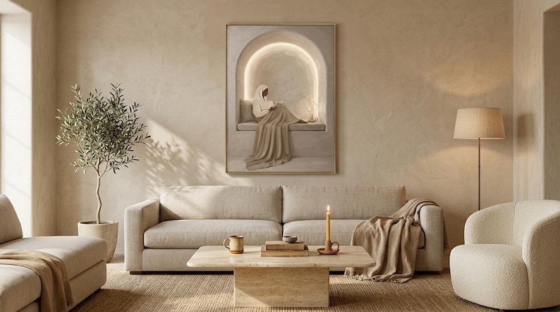 May include: A framed wall art print depicting a figure sitting in a glowing arched alcove, displayed above a beige sofa in a living room with a coffee table, a floor lamp, a potted olive tree, and a textured rug in neutral earth tones.