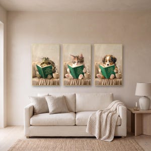 Three prints from the set, the tortoise, the kitten and the puppy, framed in a row above a cream linen sofa, with a ceramic lamp on an oak side table beside it
