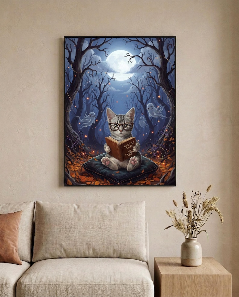 The kitten and ghosts ghost reading print framed in a calm neutral living room above a linen sofa