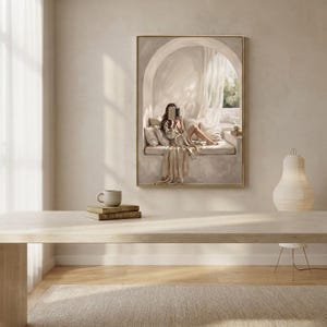 Woman reading nook wall art hung in a quiet bedroom with textured plaster walls, linen bedding, and a thin gold frame, no mat.