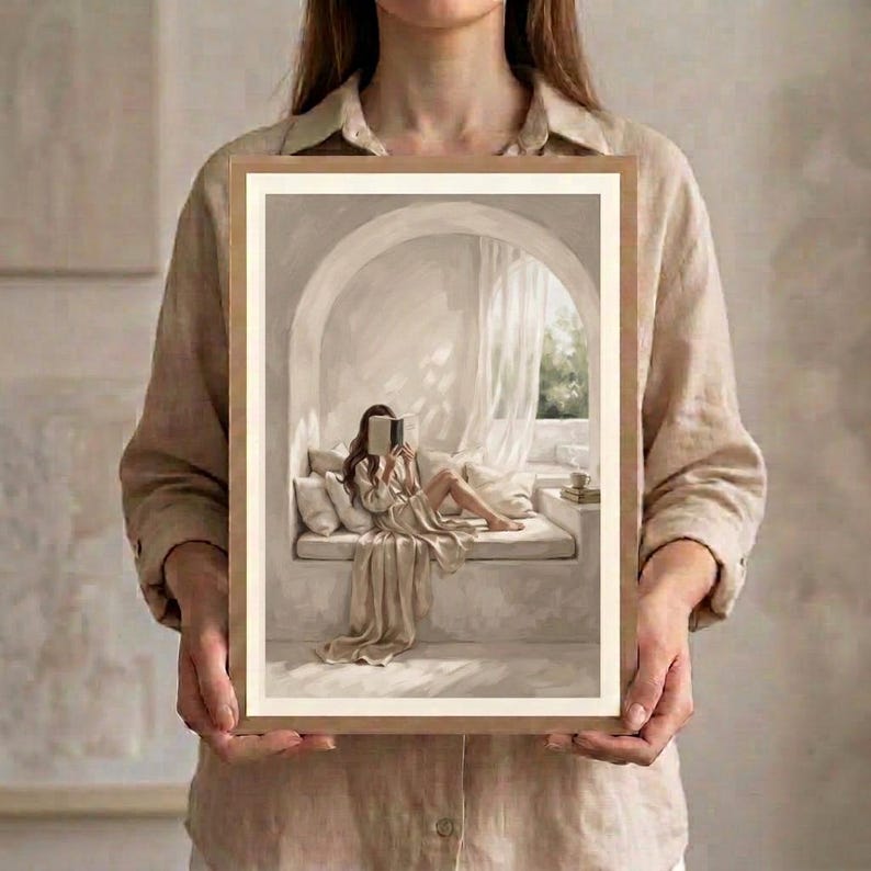 Neutral woman reading nook art in a restrained workspace with pale walls, natural linen textures, and a thin gold frame, no mat.