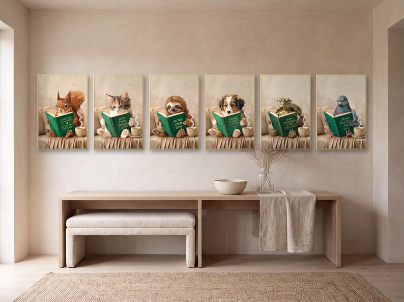 All six reading animal prints hung in a single long row in gold frames above a pale oak console table, with a bouclé bench beneath and a jute rug on the floor