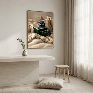 The framed pigeon print on a pale wall above a plaster bench, with a wooden stool, a floor cushion and a sheer curtain in soft daylight