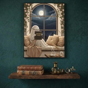 The window seat coffee ghost reading print framed on a deep teal wall above a narrow shelf with antique books and a brass candlestick