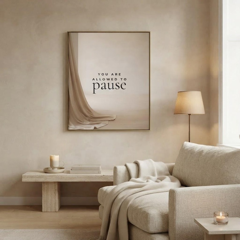 You Are Allowed to Pause styled in a calm neutral living room, hung in a thin gold frame with no mat. neutral printable wall art, minimalist home decor, Japandi style, calm living room decor, slow living digital download.