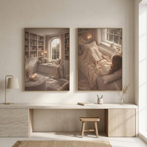 Two minimalist wall art prints in gold frames above a pale travertine desk with a wooden stool, brass lamp and jute rug. Beige wall art pair for a quiet home office or study corner.
