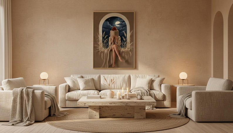 Wide view of a neutral living room with the moonlit reading print framed above a low linen sofa in soft daylight