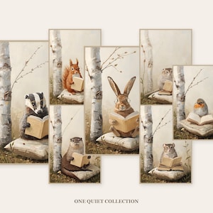Seven framed woodland nursery prints arranged on a cream wall - badger, red squirrel, otter, hare and other animals reading books