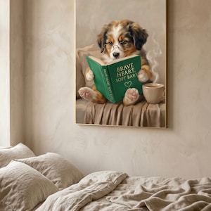 The puppy print in a thin gold frame hanging above a bed with rumpled linen bedding
