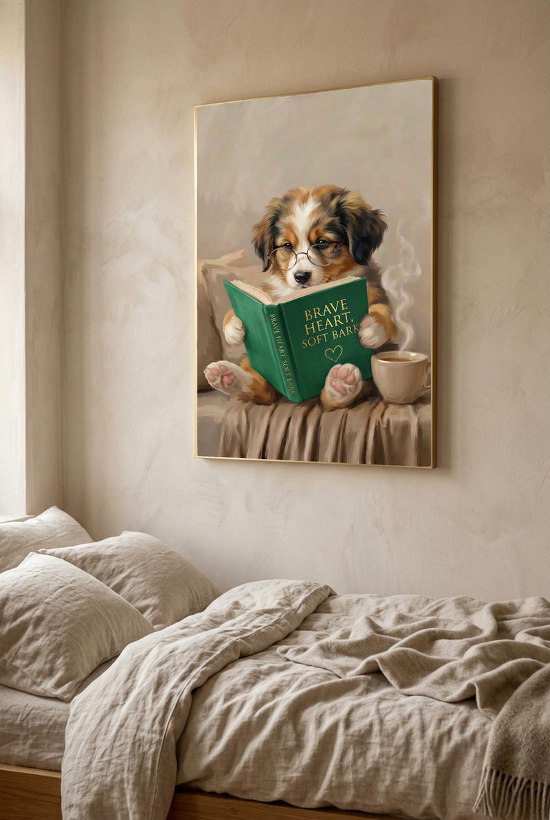 The puppy print in a thin gold frame hanging above a bed with rumpled linen bedding