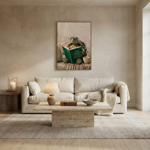 Turtle reading wall art framed on a warm plaster wall in a calm light-filled living room with a cream linen sofa