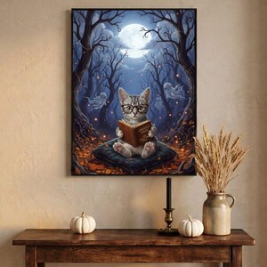 The kitten and ghosts ghost reading print framed above an entryway console styled for autumn with white pumpkins and dried wheat