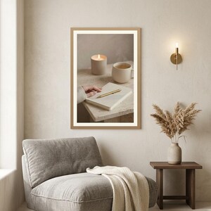 Evening journal ritual wall art printable between grey armchair and dark wood side table with pampas, neutral beige living room mockup