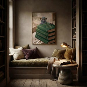 Framed pigeon peeking over books print in a quiet reading corner beside a low sofa and a small lamp