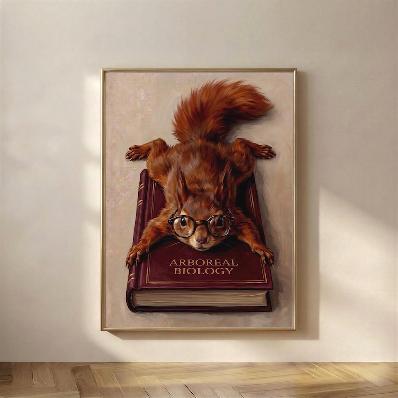Painterly print of a red squirrel in round tortoiseshell glasses splayed flat across a deep wine clothbound book lettered Arboreal Biology in gold, framed on a warm plaster wall