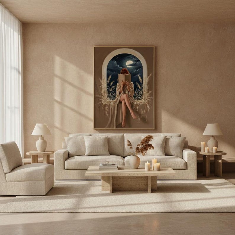 Moonlit reading wall art framed in a calm light-filled living room with warm plaster walls and a linen sofa