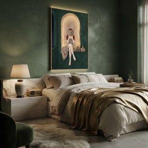 Emerald green reading nook art print on a deep green plaster bedroom wall, above a bed dressed in linen and bronze silk with a stone nightstand, ceramic lamp and a cup of tea.