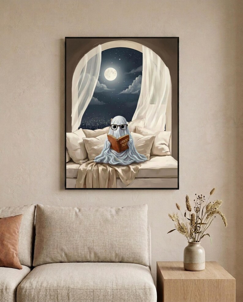 The moonlit bed ghost reading print framed in a calm neutral living room above a linen sofa