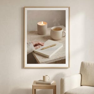 Evening journal ritual wall art printable above wooden side table with white armchair, neutral beige home office decor mockup