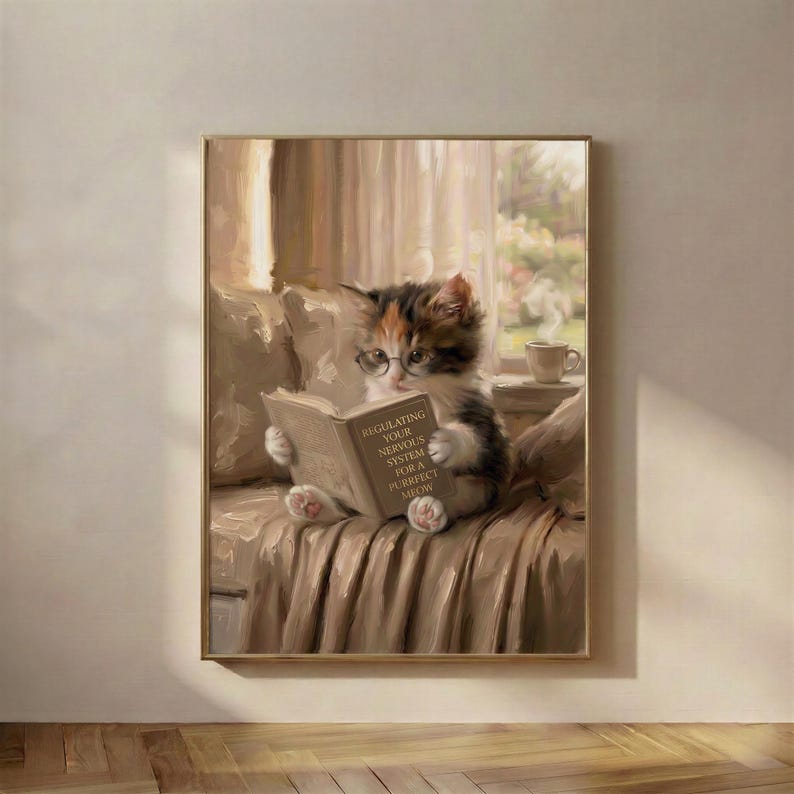 Painterly print of a calico kitten in round glasses reading a book titled Regulating Your Nervous System For A Purrfect Meow, in a thin wood frame on a warm plaster wall above a pale wood floor