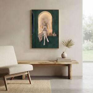 Emerald green reading nook art print on a pale plaster wall above a live-edge oak bench holding a stoneware vase with a dried palm, beside a linen armchair and a garden window.