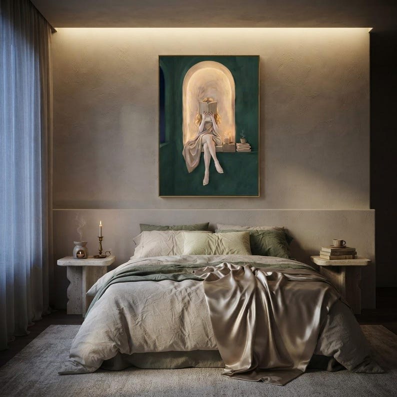 Emerald green reading nook art print above a bed made up in sage linen and champagne silk, on a warm plaster wall lit by a cove light, with candlelight and travertine nightstands.