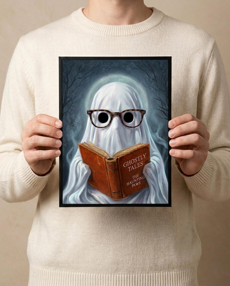 A person holding the framed ghost reading print, showing its scale against the body