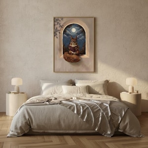 Squirrel reading wall art framed above a bed with linen bedding in a quiet neutral bedroom