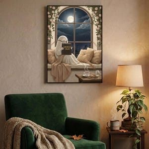The window seat coffee ghost reading print framed above a green velvet armchair with a knit throw and a warm lamp