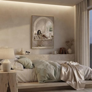 Black woman reading nook wall art hung in a quiet bedroom with textured plaster walls, linen bedding, and a thin gold frame, no mat.