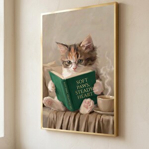 Close view of the kitten print in a thin gold frame, the art filling the frame edge to edge
