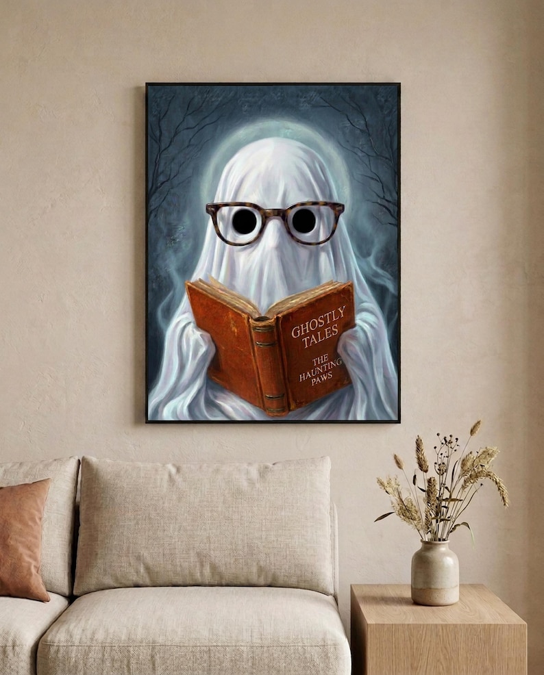The ghost reading print in a calm neutral living room with a linen sofa and dried stems