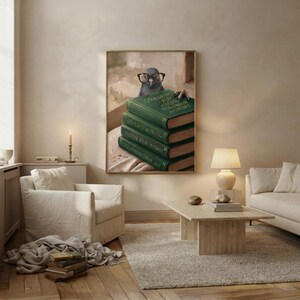Pigeon peeking over books wall art framed on a warm plaster wall in a calm light-filled living room with a cream linen sofa