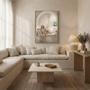 Same woman reading nook art in a calm light-filled living room with warm plaster walls and a thin gold frame, no mat.