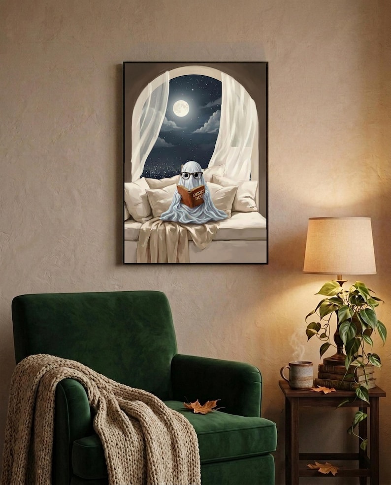 The moonlit bed ghost reading print framed above a green velvet armchair with a knit throw and a warm lamp