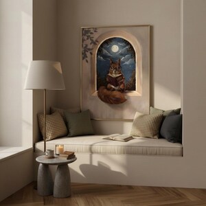 The squirrel reading print framed in a contained reading nook above a cushioned bench with cushions and a throw