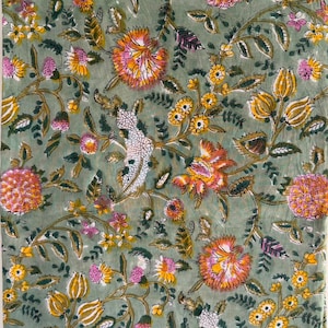 May include: A sage green fabric featuring a repeating floral pattern with pink, orange, and yellow blossoms, along with dark green leaves and white textured botanical elements, creating a dense, colorful, and intricate nature-inspired design.