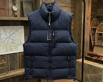 Chaleco acolchado de polo, azul marino y negro, con motivo de jinete bordado.