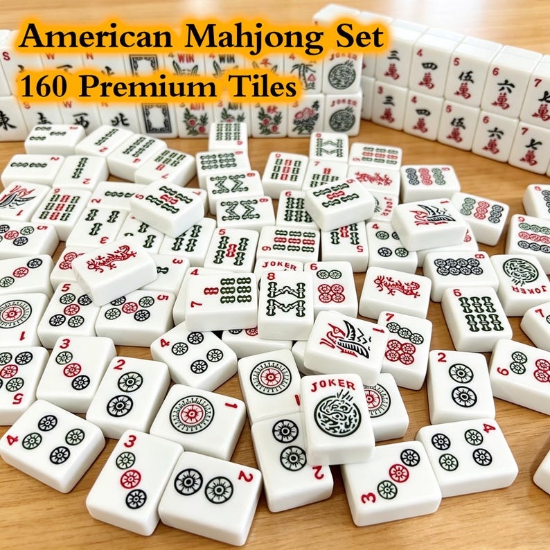 May include: An American Mahjong set featuring 160 premium white tiles with black, red, and green engraved markings. The tiles display various numbers, symbols, dragon motifs, and Joker labels, arranged in a scattered pile and a neat row.