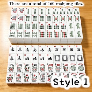 May include: A set of 160 white mahjong tiles arranged in rows, featuring various red, green, and black printed symbols, numbers, and characters. The tiles include suits, winds, seasons, and joker tiles, with the text There are a total of 160 mahjong tiles and Style 1 visible.
