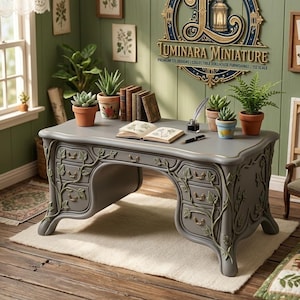 May include: A miniature gray desk with ornate leaf carvings and drawers, set in a dollhouse scene. The desk is adorned with books, plants, and a quill pen. The scene includes a window, artwork, and a sign that reads "Luminara Miniature".