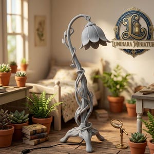 May include: A gray, floral-shaped table lamp with a curved stem and a flower-like shade. The lamp is intricately designed with a vine-like pattern. The lamp is plugged into an outlet. The background includes a miniature bedroom setting with potted plants and books.