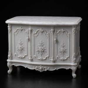 May include: A light gray cabinet featuring a smooth marble top and three doors. The front panels are decorated with intricate floral carvings and scrollwork details. The piece stands on four curved legs and has a polished, uniform finish.