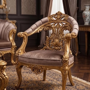 May include: An elaborately carved gold armchair with a curved back and armrests. The chair has a mauve-colored seat and backrest. The design includes detailed carvings. Another chair of the same style is visible in the background.