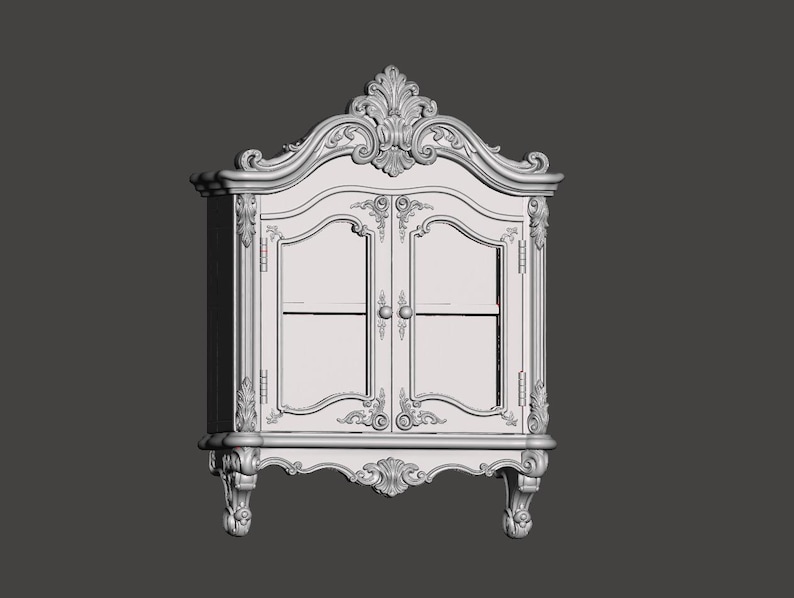 May include: A light gray wall-mounted cabinet featuring two glass-paneled doors with small round knobs. The frame is decorated with intricate carved scrollwork and floral motifs along the top crest, corners, and the base, supported by two feet.
