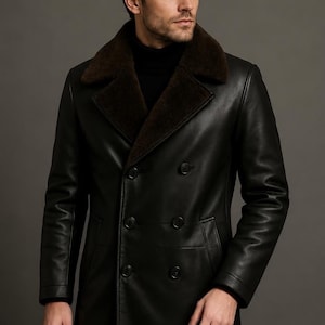 May include: A black leather coat with a brown fur collar. The double-breasted coat has large black buttons and a tailored fit. The model is wearing a black turtleneck. The coat is a classic outerwear piece.