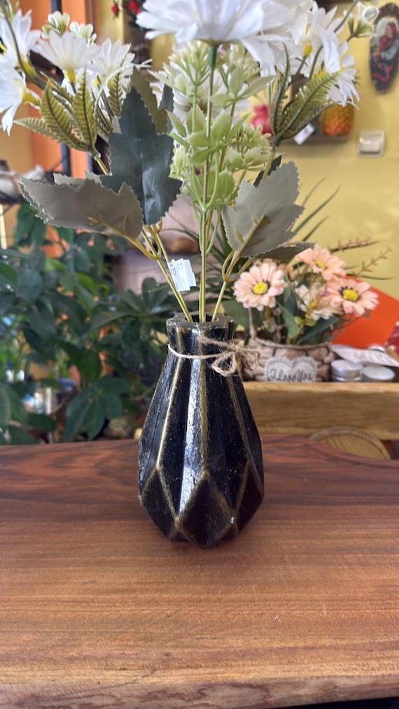 Geometric concrete bud vase with a rustic gold-and-black finish — handcrafted architectural minimalism that punches well above its price in shelf presence.