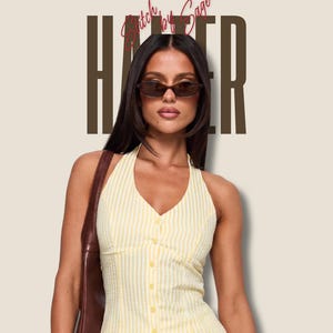May include: A printable PDF sewing pattern for a yellow and white striped halter top with a V-neckline and a front button closure. The text on the image reads PRINTABLE PDF SEWING PATTERN and Stitch by Sage and HALTER.
