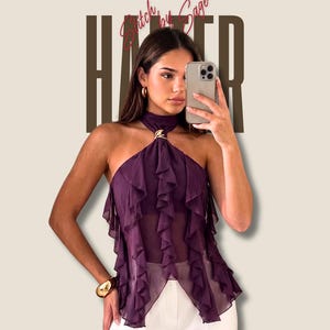 May include: A deep purple sleeveless top featuring a high halter neckline with a gold-toned metal accent, vertical ruffled fabric layers, and a sheer finish. The text DETAILED PDF SEWING PATTERN and Stitch by Sage are visible at the top.