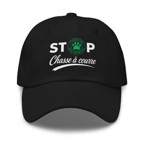 May include: A black baseball cap featuring white text that reads STOP and Chasse à courre, with a circular green logo in the centre containing a paw print and the text Touche pas aux animaux collection, all centred on the front panel.